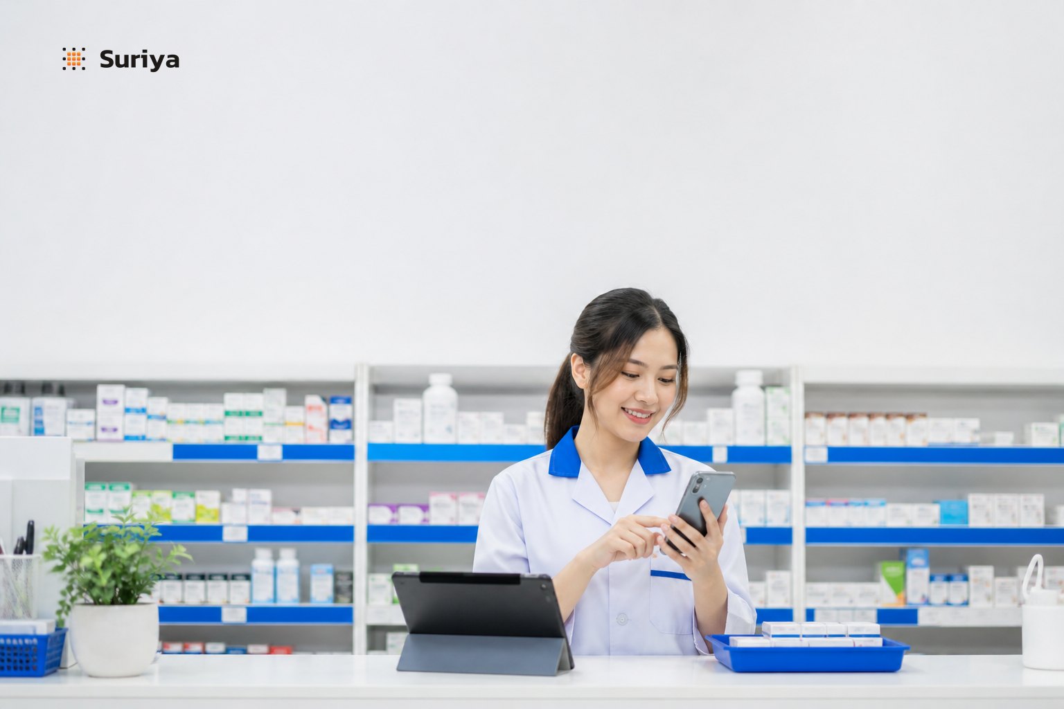 Pharmacist checking an AI assistant dashboard on a tablet at a Thai pharmacy counter